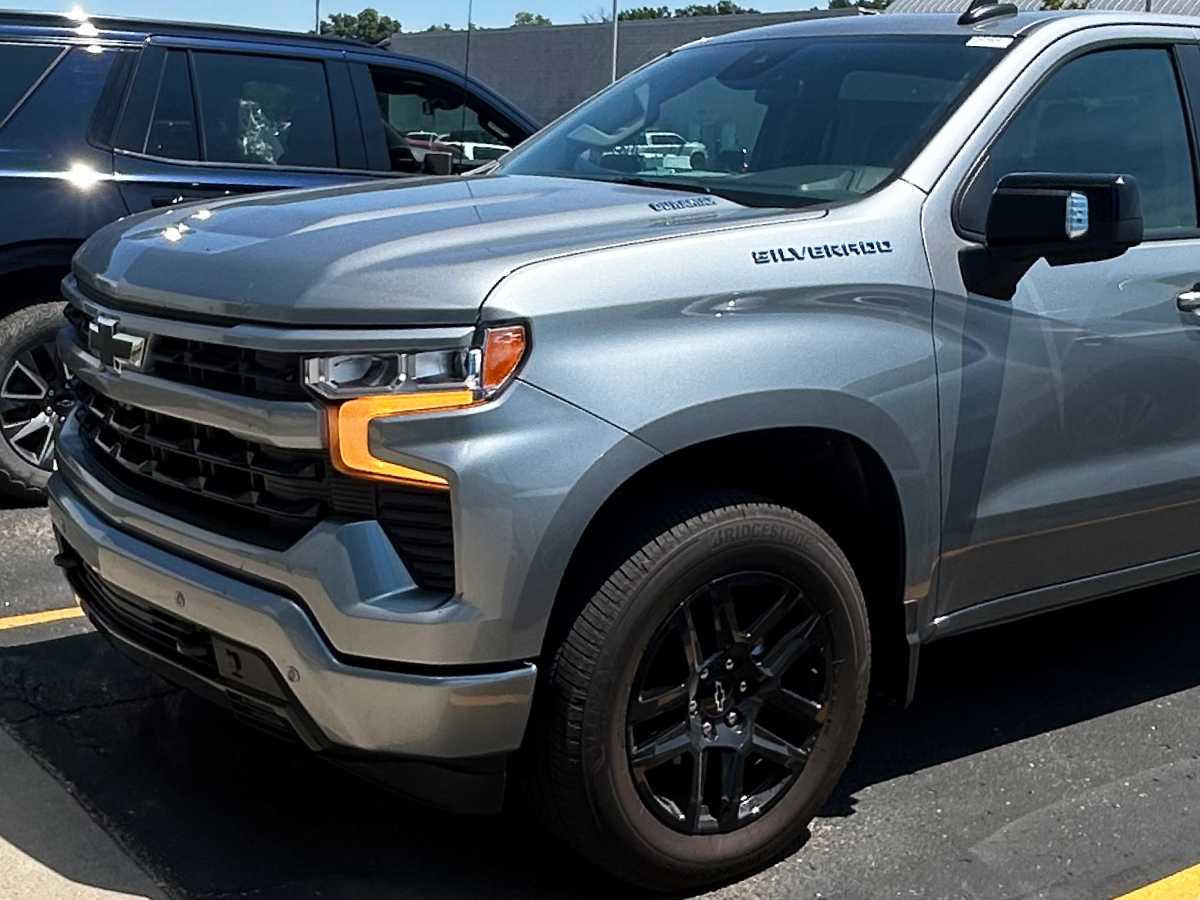 Gray Chevrolet Silverado front end restored to factory condition after collision repair at Al Serra Body Shop